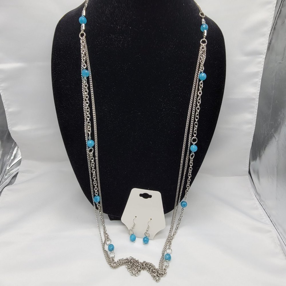 3 strand necklace with blue beads and earrings
